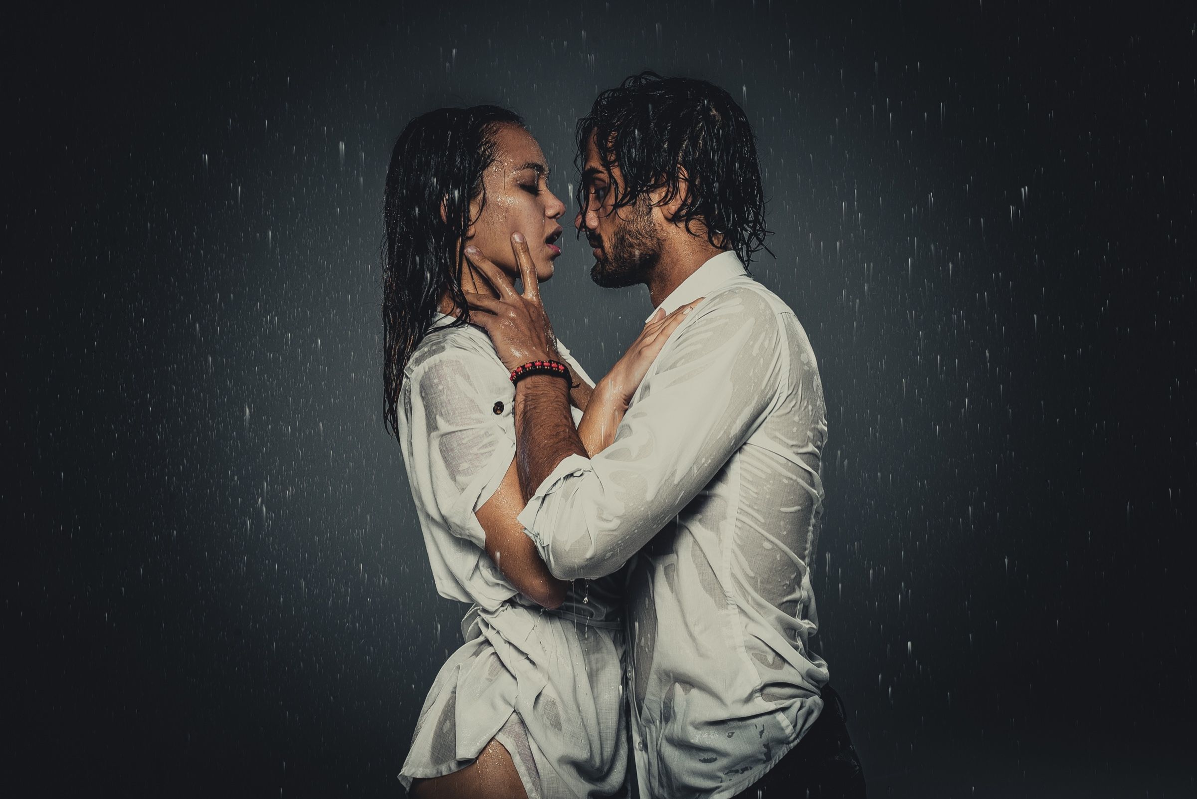 A couple in a close embrace in the rain
