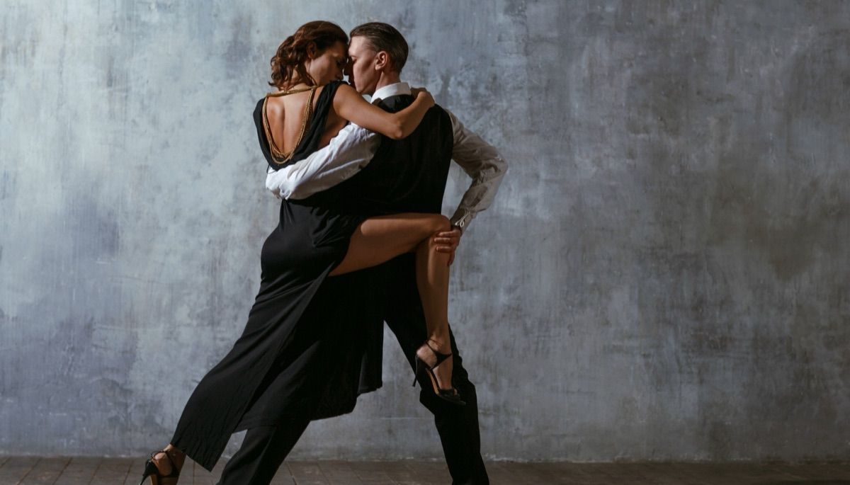 An elegant couple in a tango pose